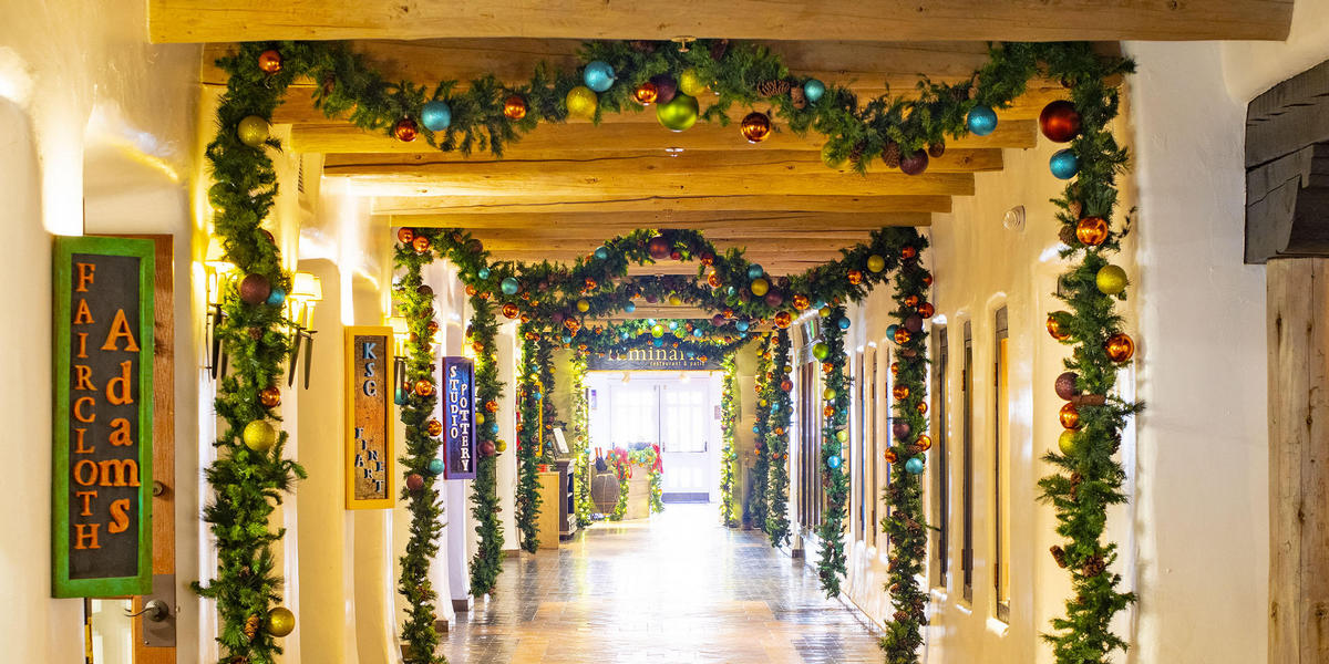 Hallway of shops at Loretto decorated with garland