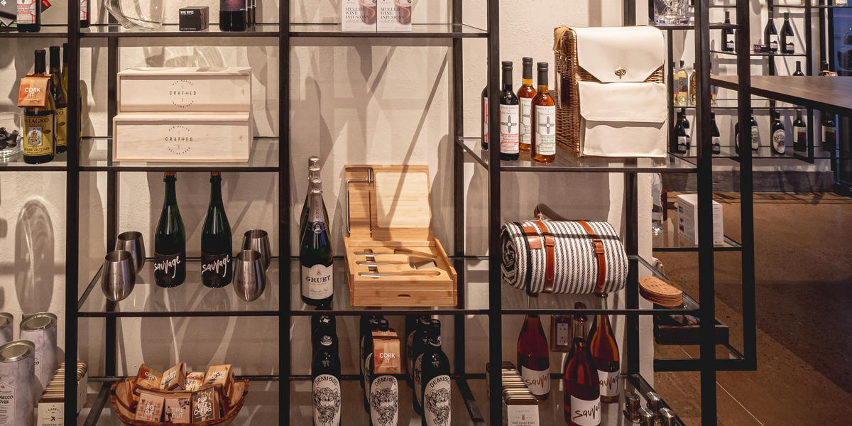 Crafted shelves with bottles of wine and spirits for purchase